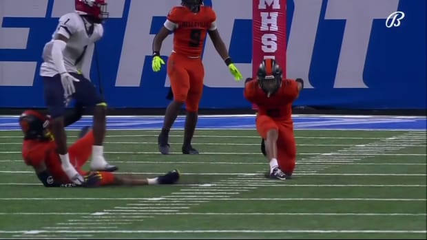 Michigan high schooler Adrian Walker Jr. catches an interception behind his back.